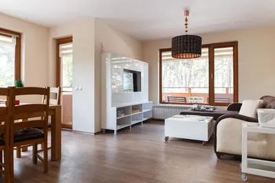 a living room with a couch and a table at Апартамент 