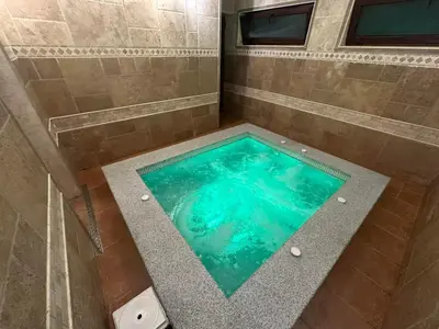 an overhead view of a tub in a shower at Family Hotel Bunara in Brestnik