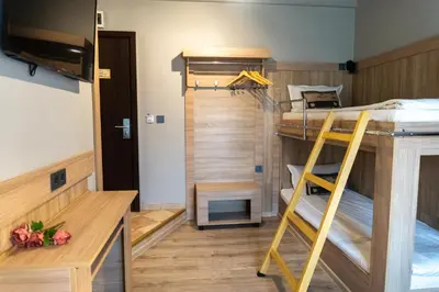 a room with two bunk beds and a ladder at Hotel Allur in Plovdiv