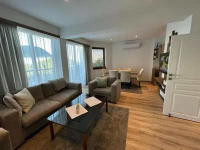 a living room with a couch and a table at Amampuri Village in Pamporovo