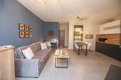 a living room with a couch and a table at Artemis Apartments in Sandanski