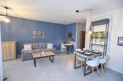 a living room with a couch and a table at Artemis Apartments in Sandanski