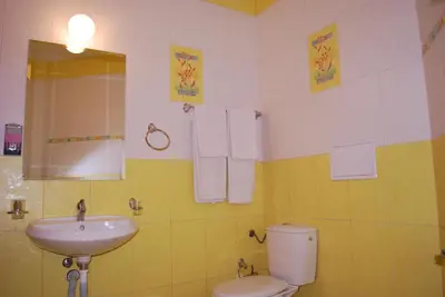a bathroom with a sink and a toilet at Hotel Milenium in Sofia