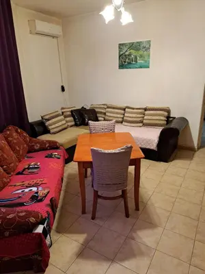 a living room with a couch and a table at relax in Plovdiv