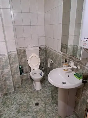 a bathroom with a toilet and a sink at relax in Plovdiv