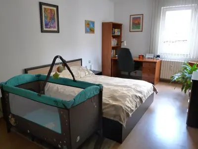 a bedroom with a bed and a desk and a chair at Art31 in Sofia