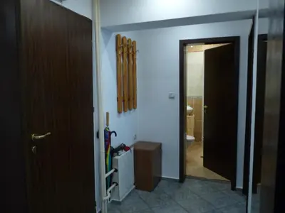 a hallway with a room with a door and a bathroom at Art31 in Sofia