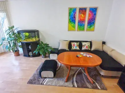 a living room with a couch and a table at Art31 in Sofia