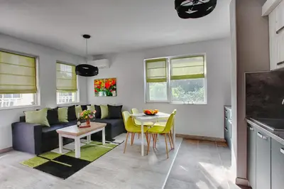 a living room with a couch and a table at ApArt apartments in Plovdiv