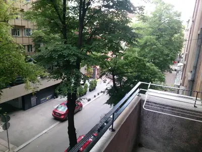a view of a street with a car parked on the street at Solunska Apartment in Sofia