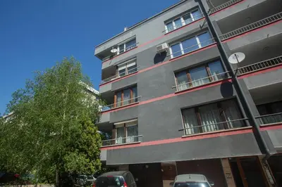 a building with cars parked in front of it at Spacious flat close to the American Embassy, free parking place in Sofia