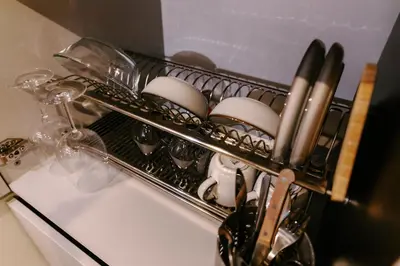 a drying rack on a sink with eggs in it at Vinyl Studio Apartment Sofia in Sofia