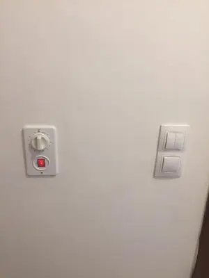 a close up of a white door with a red button at Belvedere holiday apartment in Bansko