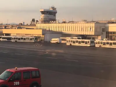 a red van parked in front of an airport at Belvedere holiday apartment in Bansko