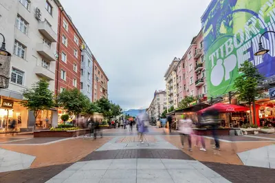 a group of people walking down a city street at The Charming Home - One Bedroom TOP Central Apartment by Flat Mаnager in Sofia