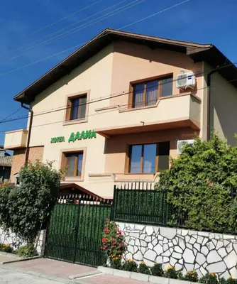 a building with a fence in front of it at Family Hotel Dalia in Velingrad