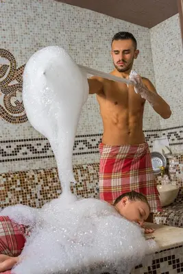 a man in a bathtub making a swan at Royal Park Hotel by Astoria Collection in Bansko