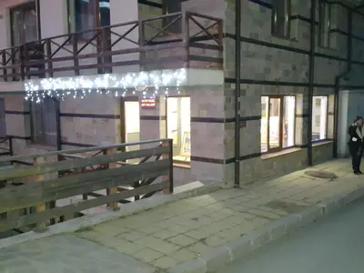 a building with lights on the side of it at Snow Pearl Residence & FREE SPA in Bansko
