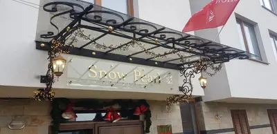 a sign for a showroom on the side of a building at Snow Pearl Residence & FREE SPA in Bansko