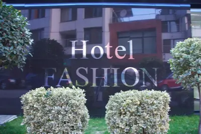 a hotel sign in the window of a building at Hotel Fashion - Free Parking in Sofia