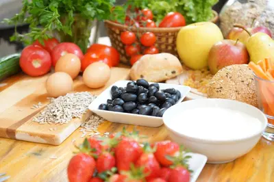 a table with fruits and vegetables on a table at Hostel Mostel Hub Rooms and Apartments in Sofia