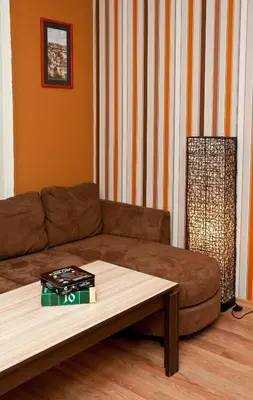 a living room with a couch and a coffee table at Hostel Mostel Hub Rooms and Apartments in Sofia