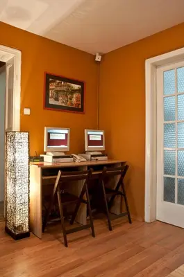 two computers sitting on a desk in a room at Hostel Mostel Hub Rooms and Apartments in Sofia