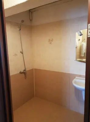 a bathroom with a shower and a sink at Hotel Diavolo in Sofia
