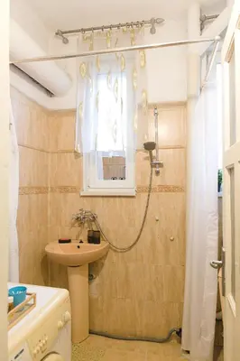 a bathroom with a sink and a shower at Botev Apartment in Sofia