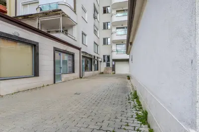 an empty street in front of a building at The M Place by Flat Mаnager in Sofia