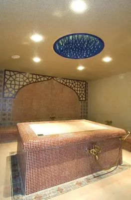 a large bathroom with a blue light on the ceiling at Aparthouse Borovo near Bulgaria Mall, free street parking in Sofia