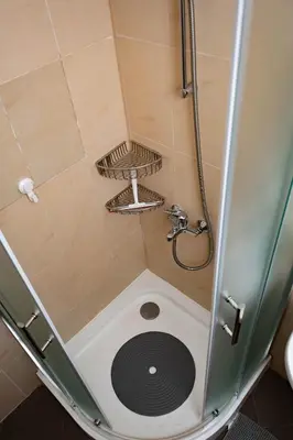 a shower with a drain in the middle of it at St. John Hill Apartment, Bansko in Bansko