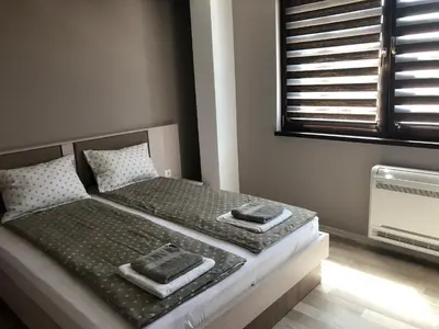 a bedroom with a bed with two towels on it at Apartment Trimontium 2 in Plovdiv