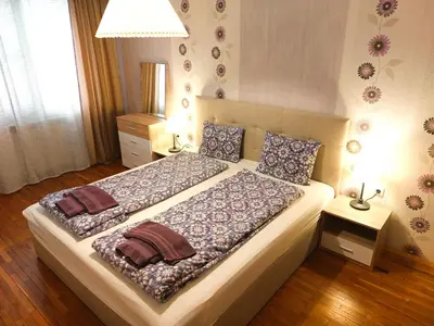 a bedroom with a large bed with two pillows at Fresh Apartment in Sofia