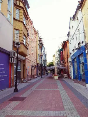 an empty street in a city with buildings at Pijama Hostel in Plovdiv