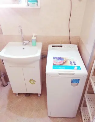 a small bathroom with a sink and a toilet and a sink at Pijama Hostel in Plovdiv
