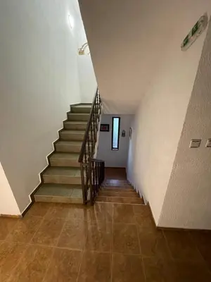 a staircase in a building with a stair case at Guest house Elit in Dobrinishte
