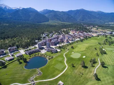 an aerial view of a resort with a golf course at Cornelia Deluxe Residence in Bansko