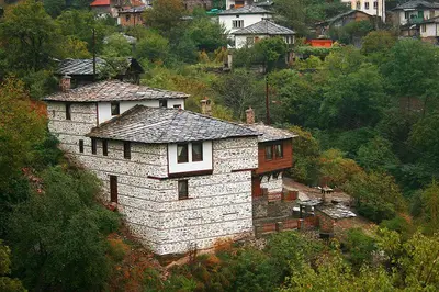 a building on the side of a hill at Complex Kosovo Houses in Kosovo