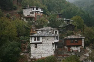 a group of houses on top of a mountain at Complex Kosovo Houses in Kosovo