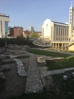 a view of a city with a cross on a building at Evergreen Sofia Apartment in Sofia