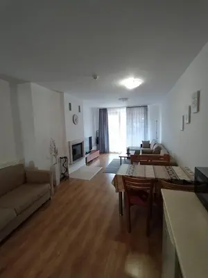 a living room with a couch and a table at New Inn in Bansko