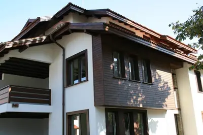 a house with a brown roof at Spa Hotel Planinata in Ribarica