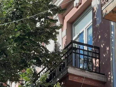 a balcony of a building with a window at Studio Cathlyn in Sofia