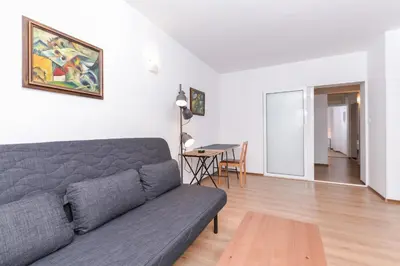 a living room with a couch and a table at Eleganto - Central 2BD Stylish Apartment by Flat Mаnager in Sofia