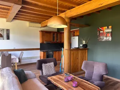 a living room with a couch and a table at Katarino Villa Nature Escape in Razlog