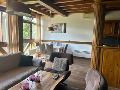 a living room with a couch and a table at Katarino Villa Nature Escape in Razlog