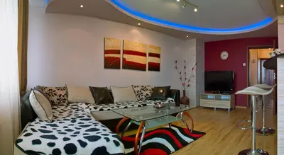 a living room with a couch and a table at Apartments Rosina in Plovdiv