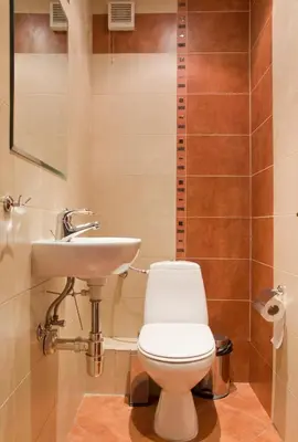 a bathroom with a toilet and a sink at Vitosha Downtown Apartments in Sofia