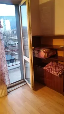 a room with a sliding glass door with a balcony at Къща за гости Пеневи in Sofia